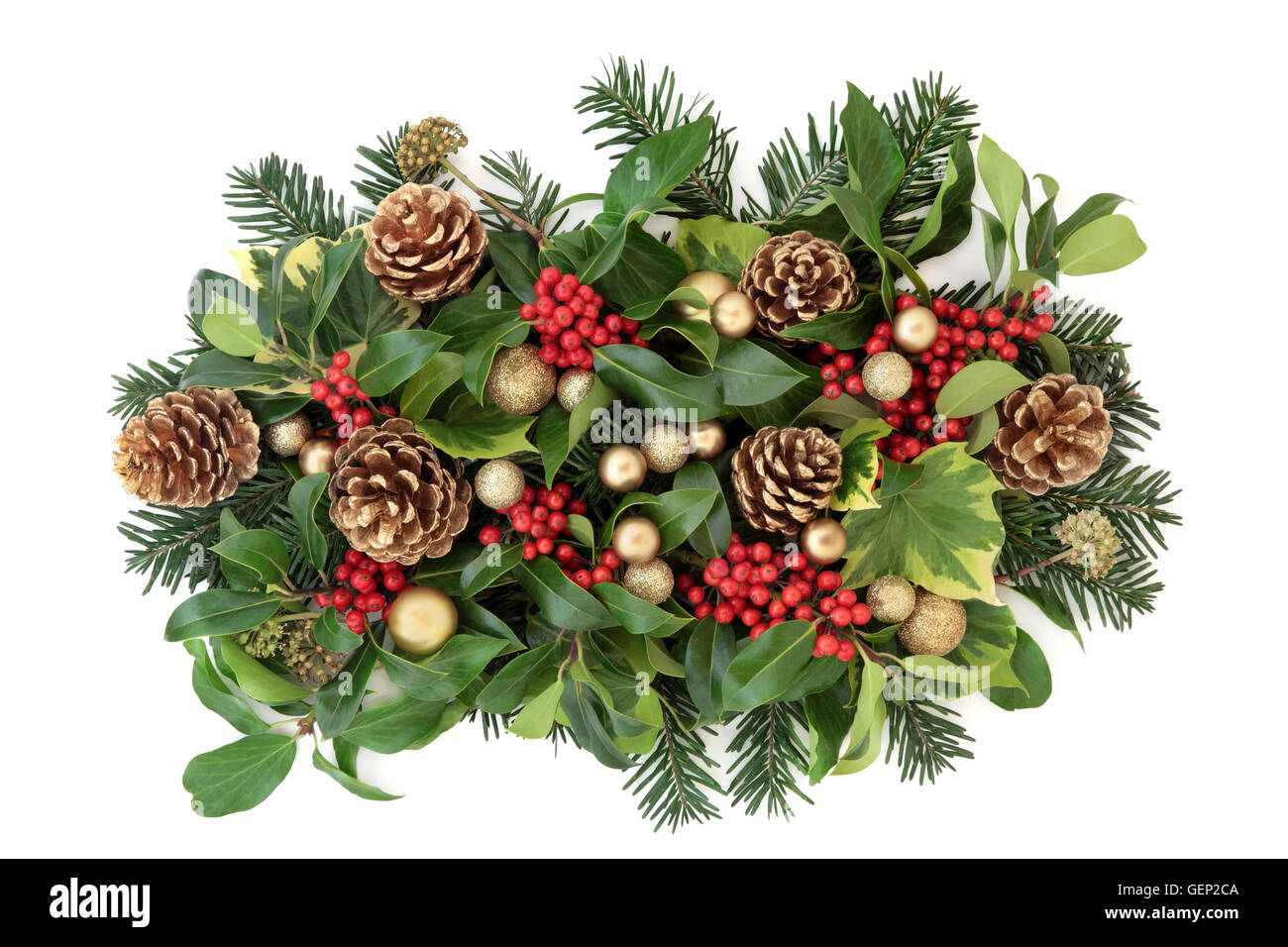 Christmas and winter decoration with gold bauble decorations, holly and