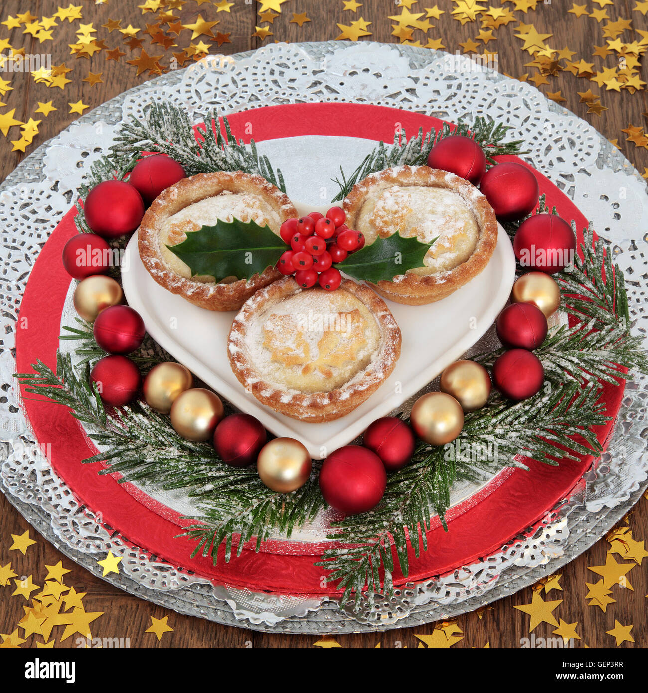 Traditional christmas mince pie cakes with red and gold bauble ...