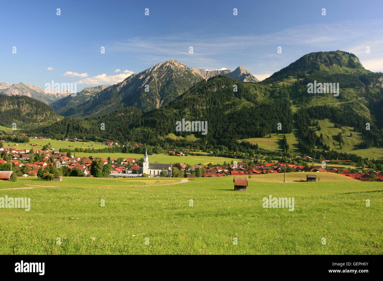 geography / travel, Germany, Bavaria, Allgaeu, Upper Allgaeu, Ostrachtal (Ostrach Valley), Bad Hindelang, church St. John, Imberger Horn (right), Stock Photo