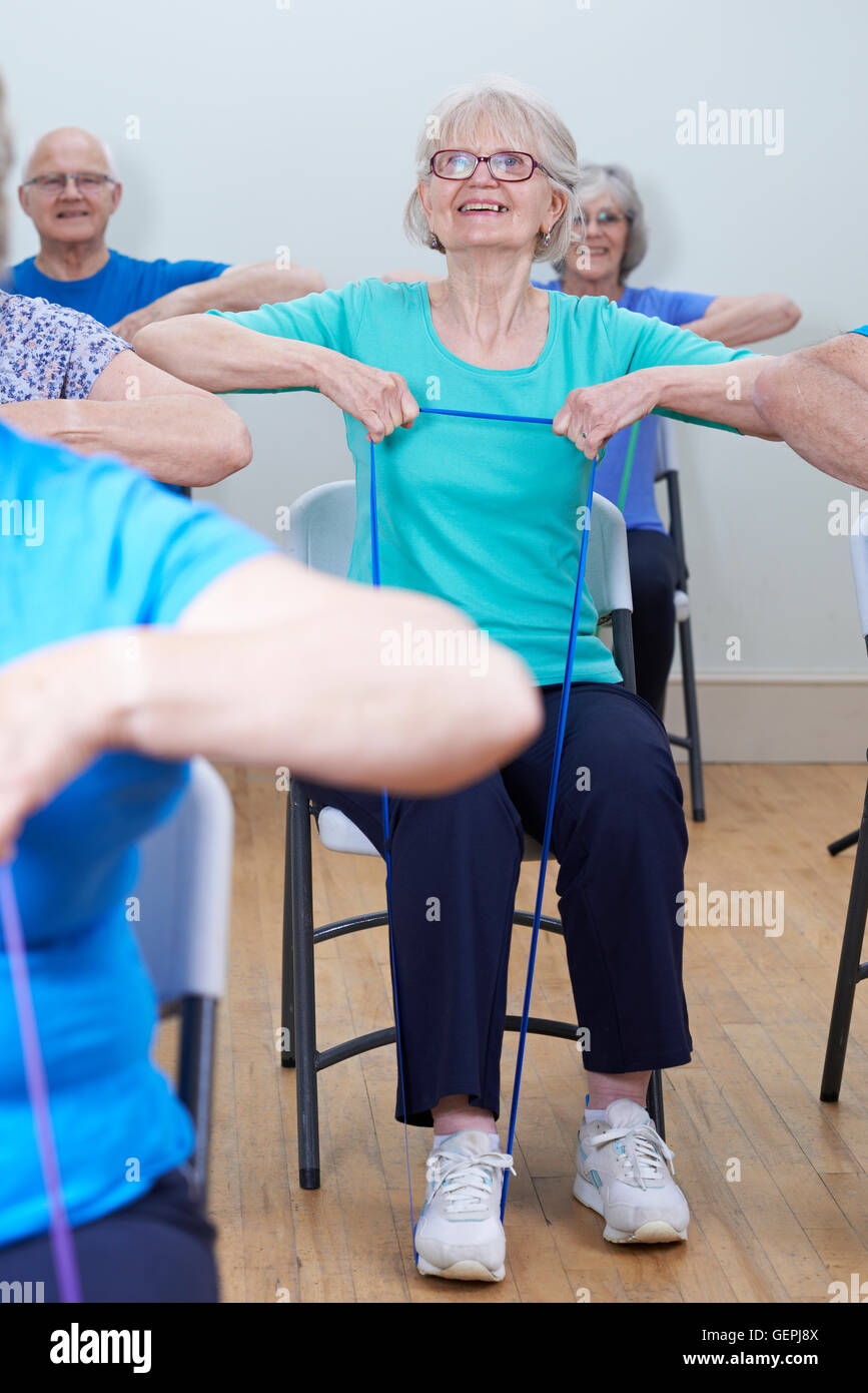 Group  Seniors Using Resistance Bands  Fitness Class   Group Of Seniors Using Resistance Bands In Fitness Stock Photo
