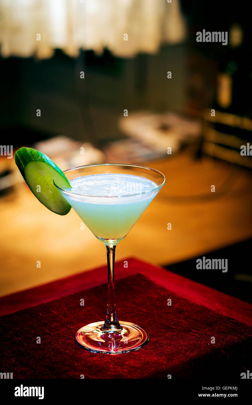 cucumber mint modern trendy martini cocktail in bar at night Stock Photo