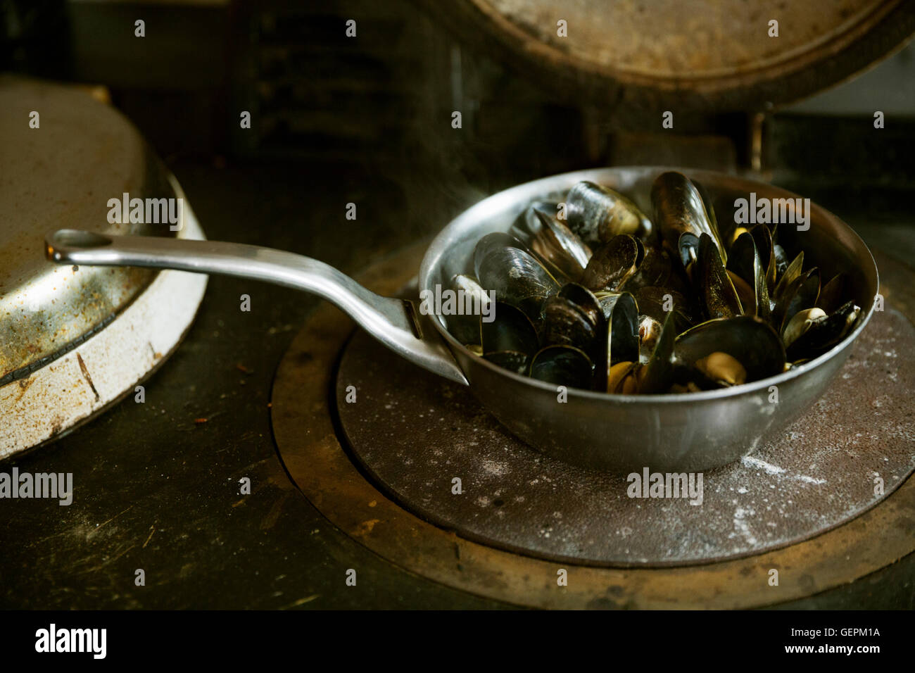 High angle view of a pan of Black Mussels. Stock Photo