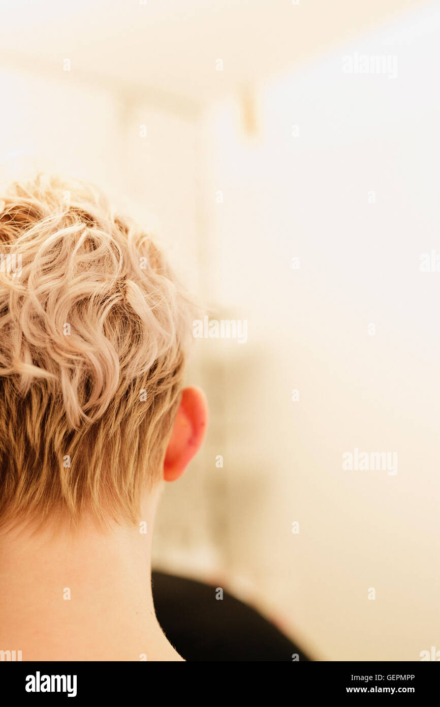 A woman with short hair at the hairdressers Stock Photo