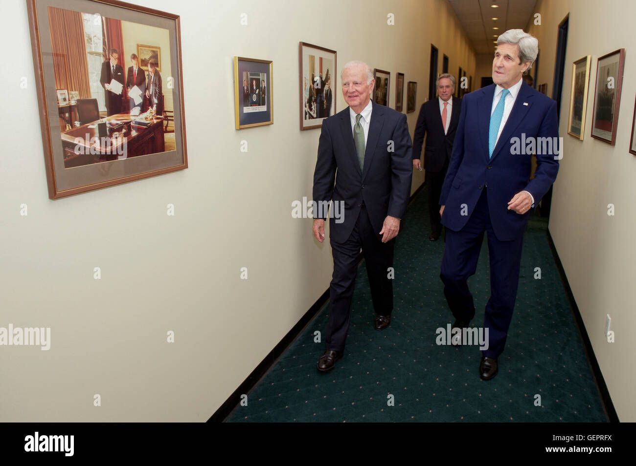 Former Secretary Kerry Baker and Secretary Kerry Walk Past Pictures