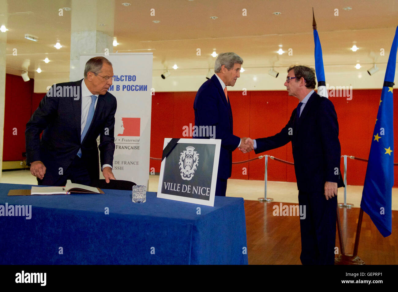 Secretary John Kerry Shakes Hands With French Ambassador to Russia Ripert at the French Embassy in Moscow Stock Photo