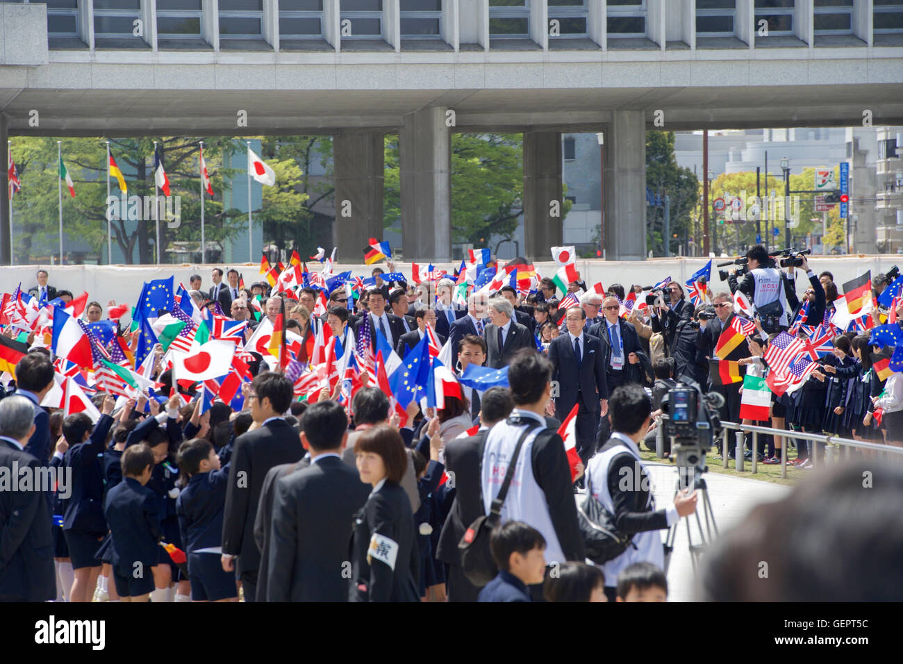 Secretary Kerry and His G7 Counterparts Pass School Children Upon Arrival at the Hiroshima Peace Memorial Park Stock Photo