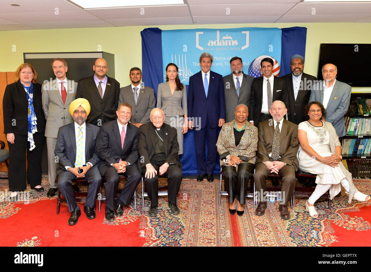 Secretary Kerry and UNHCR Special Envoy Jolie Pitt Pose for a Photo With Interfaith Leaders at an Iftar Reception to Mark World Refugee Day Stock Photo