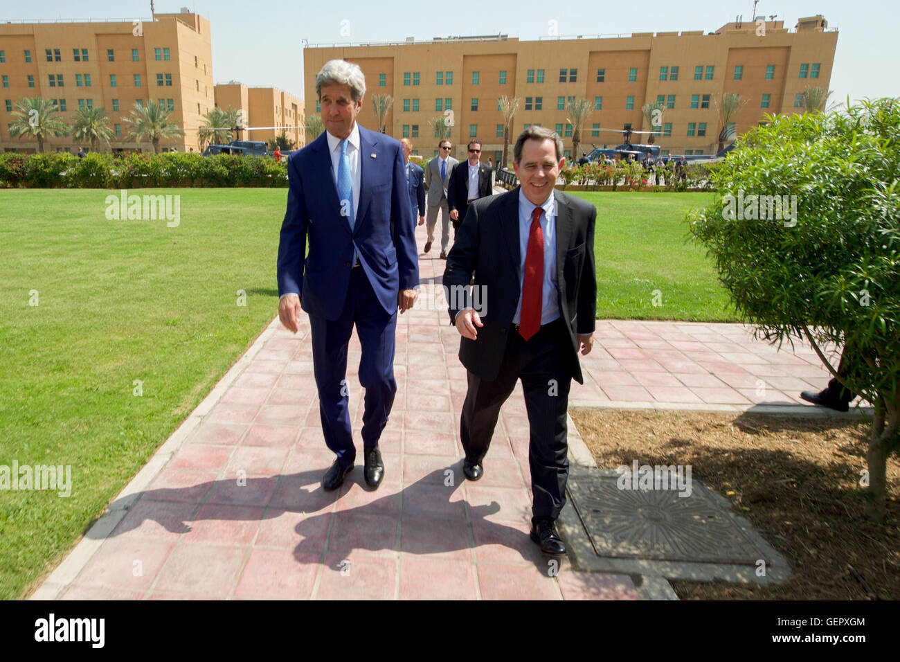 Secretary Kerry Walks With U.S. Ambassador to Iraq Jones Before Meetings With Iraqi Leaders in Baghdad Stock Photo