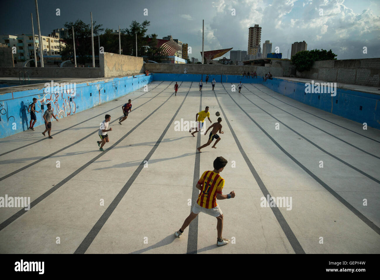Playing football in a former swimming pool, La Havana, Cuba Stock Photo