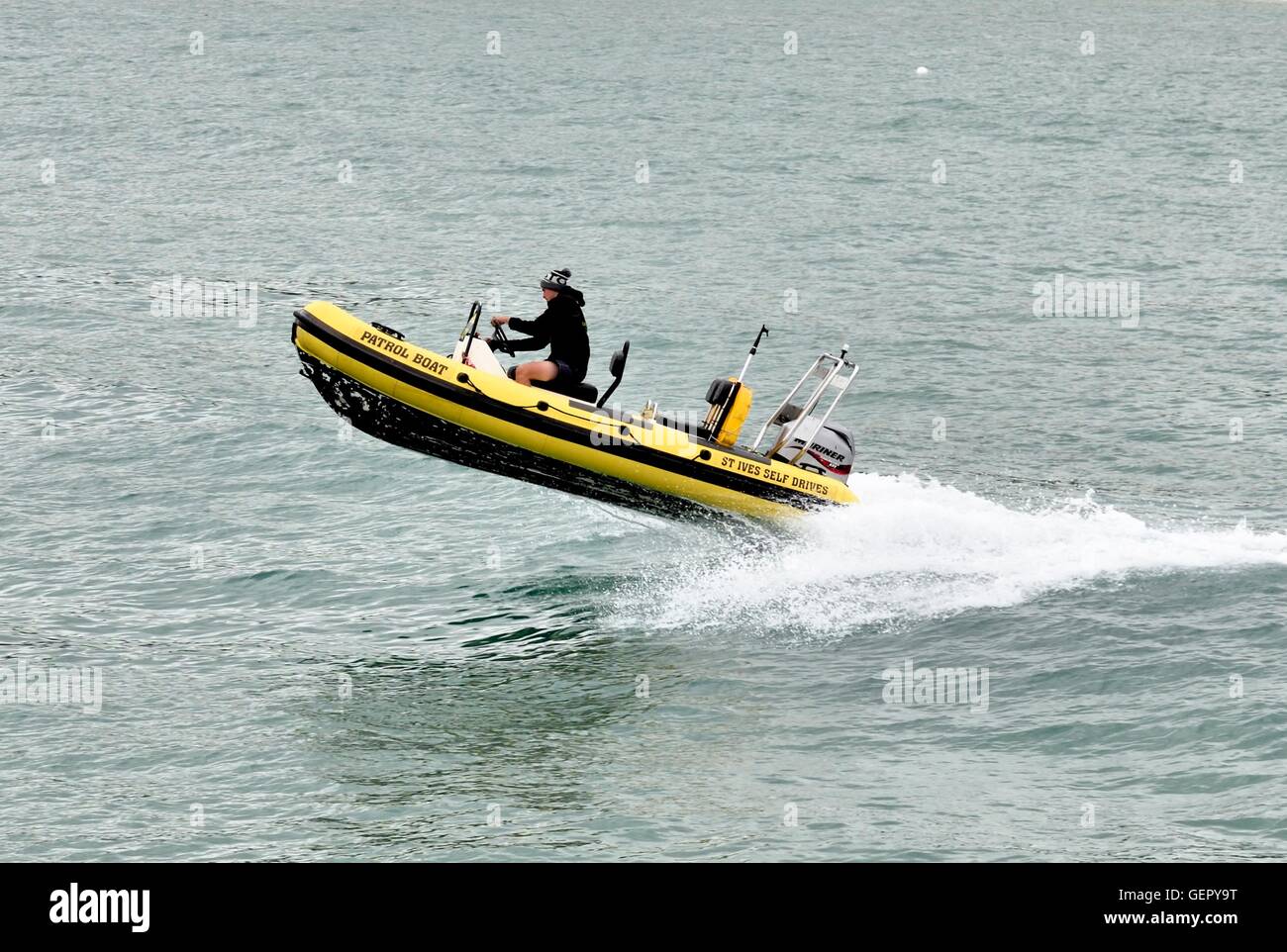 A speed boat speeding across the bay in St Ives Cornwall England UK Stock Photo
