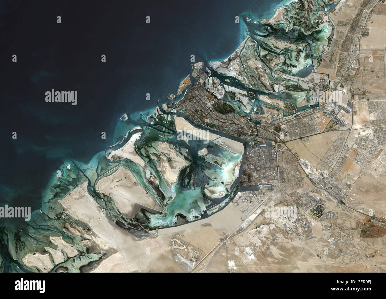 Satellite image of Abu Dhabi, United Arab Emirates, taken on June 26, 2014 by the satellite Landsat 8. The territory covered is 78 km x 55 km. Stock Photo