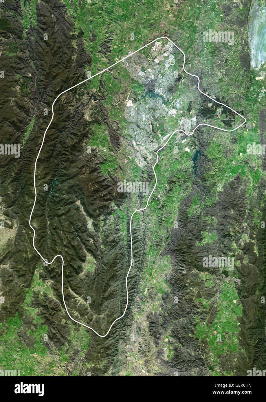 Satellite view of Canberra and the Australian Capital Territory, Australia (with administrative boundaries). Canberra is the capital city of Australia. This image was compiled from data acquired by Landsat 8 satellite in 2014. Stock Photo