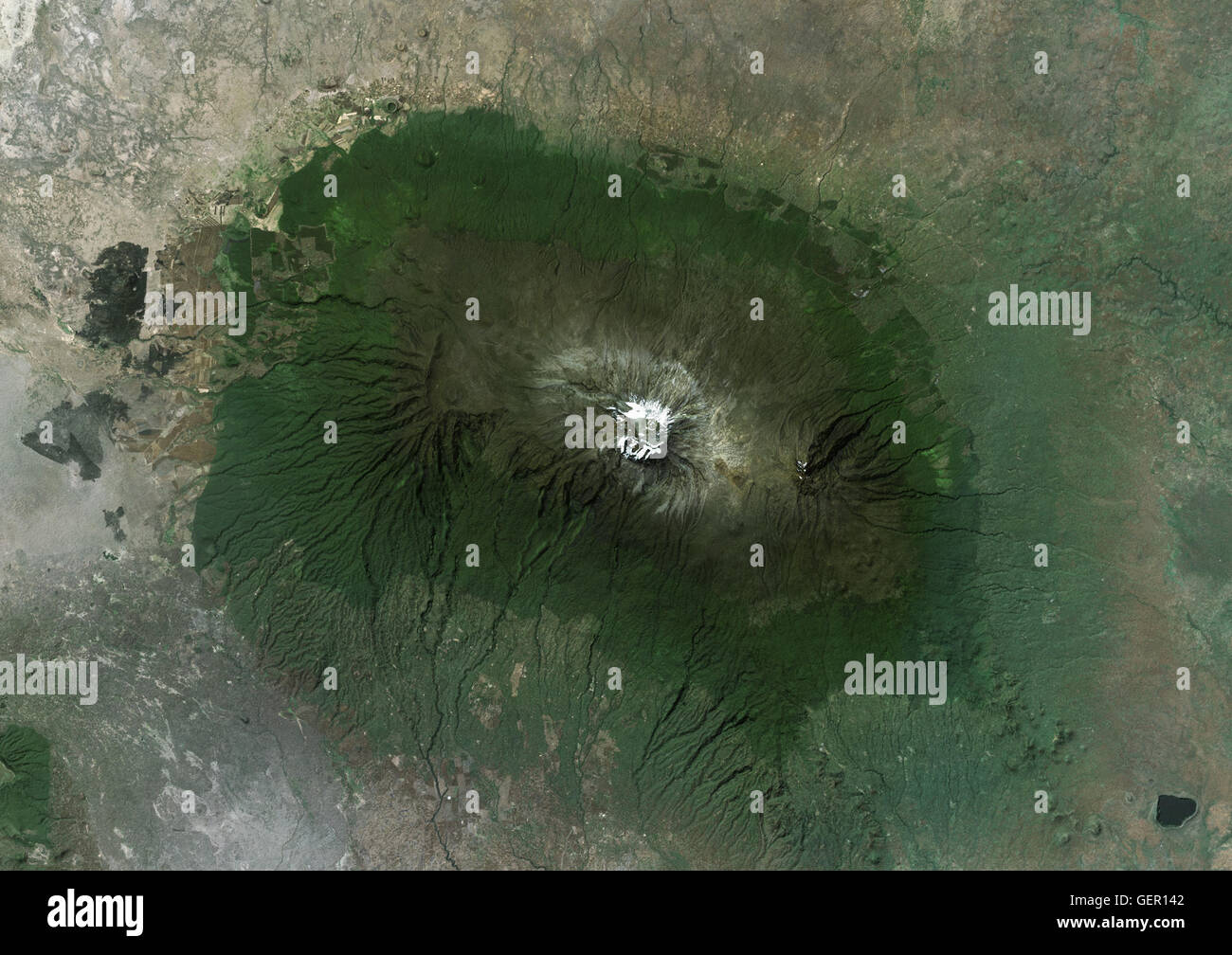 Satellite view of Mount Kilimanjaro, Tanzania. This dormant volcano is the highest mountain in Africa. It is part of the Kilimanjaro National Park. This image was compiled from data acquired by Landsat satellites. Stock Photo
