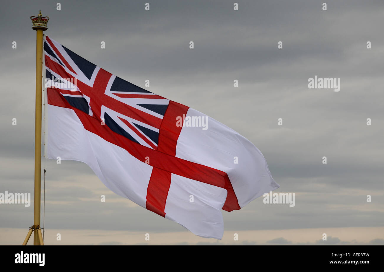 The White Ensign the flag of the Royal Navy which is flown by warships, submarines and establishments. Stock Photo