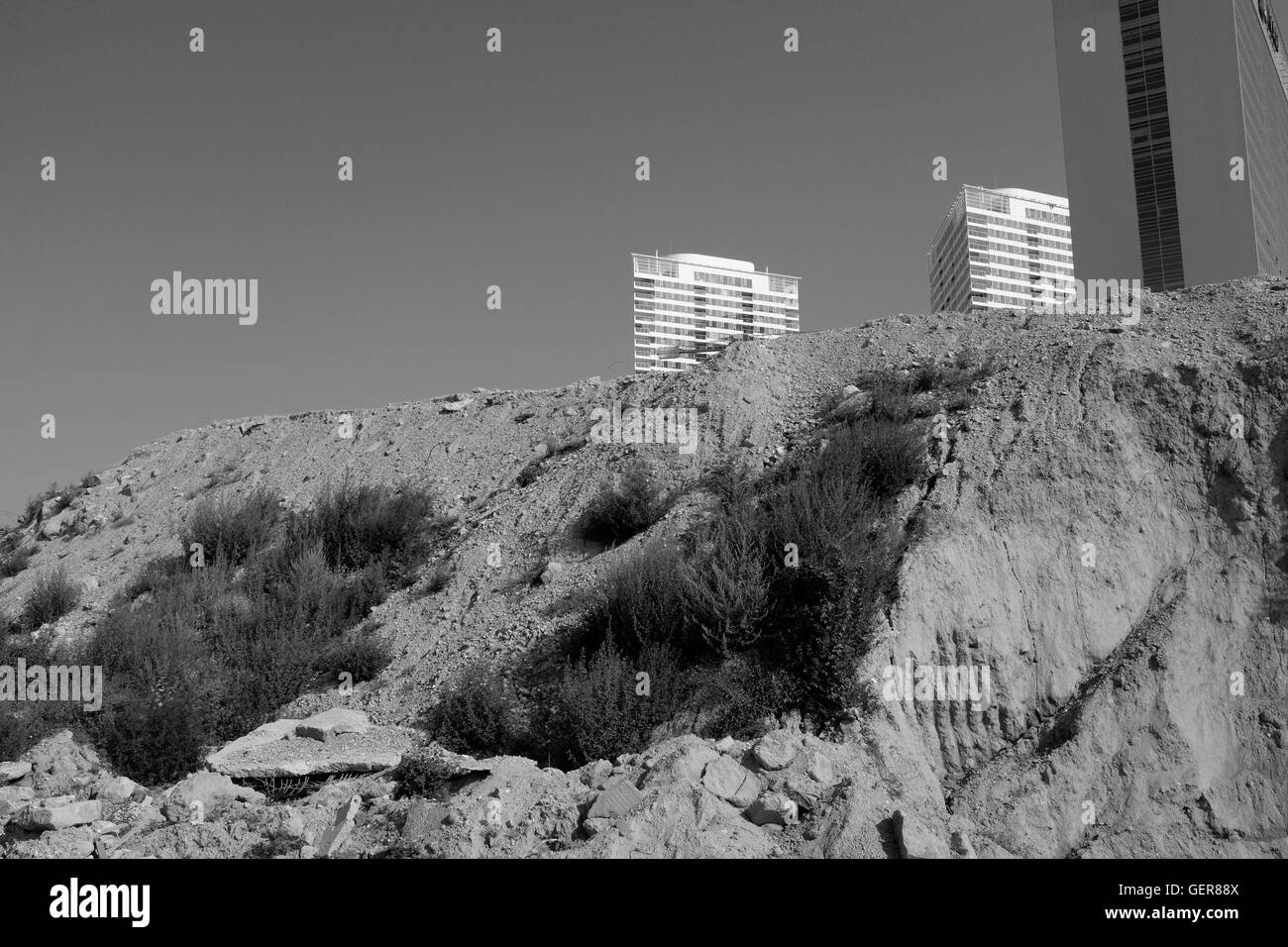 Panorama City towers behinde a soil hill Stock Photo Alamy