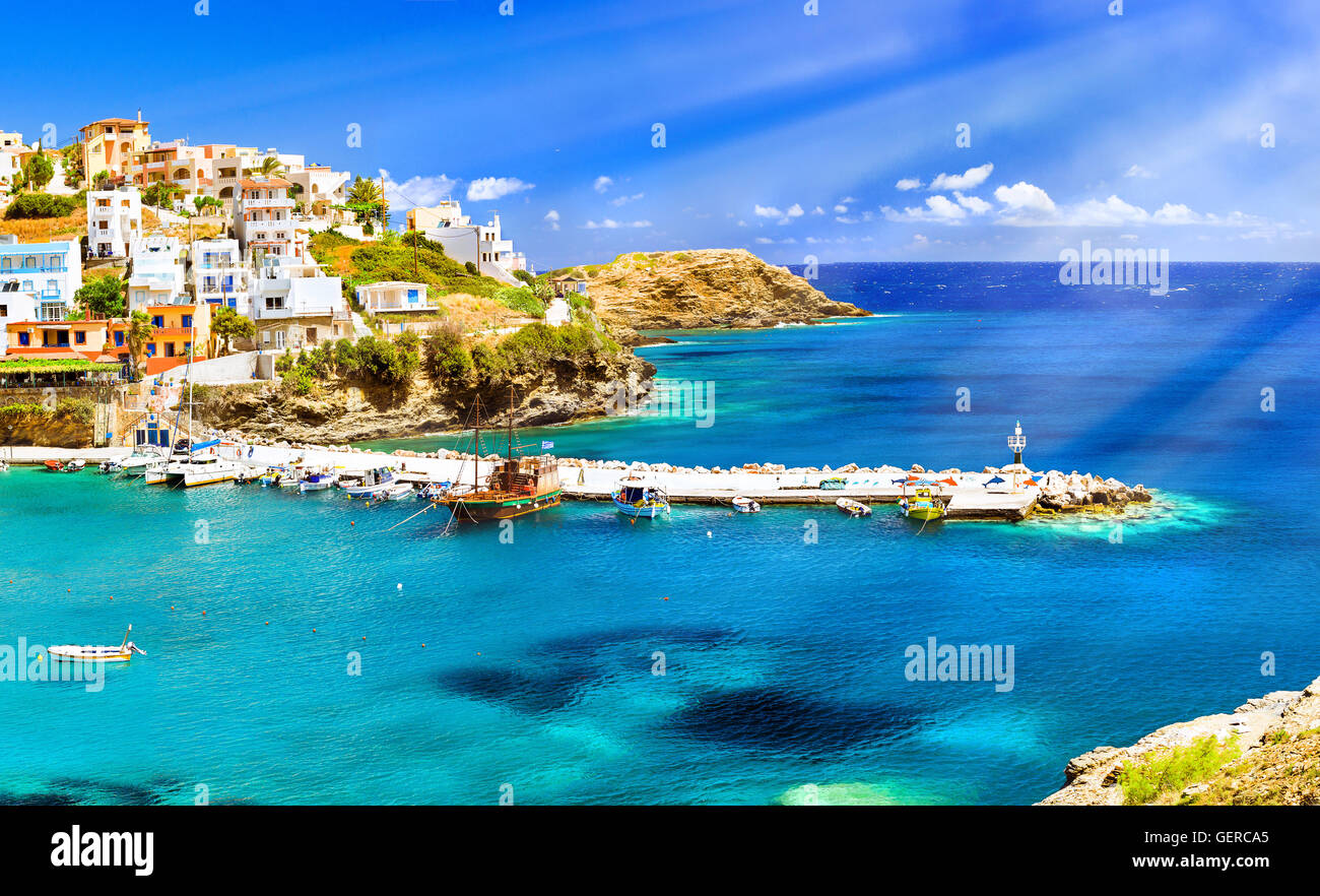 Harbour with marine vessels, boats and lighthouse. Panoramic view from a cliff on a Bay with a beach and architecture Bali Stock Photo