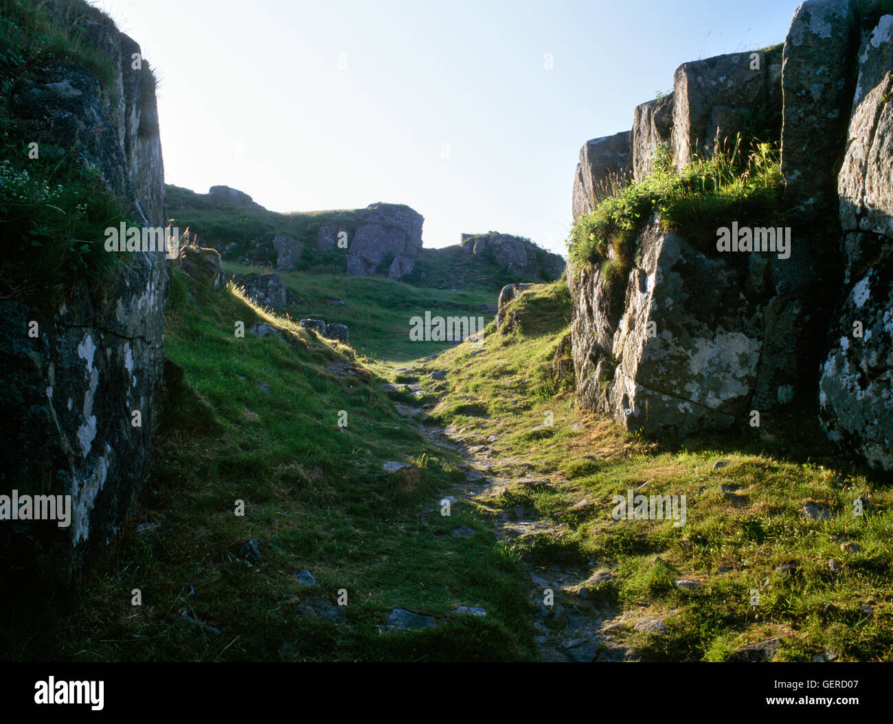 NW gateway between lower & second enclosure of Dunadd Dark Age fortress, Argyll, with citadel (topmost fort) & upper enclosures beyond. Stock Photo