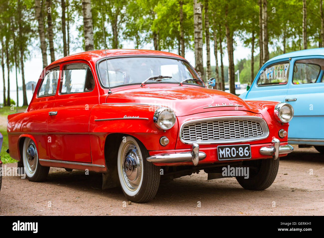KOTKA, FINLAND - JUNE 14, 2014: Red Skoda Felicia coupe parked on shore of Finnish gulf. Festival and exhibition of retro-club Stock Photo