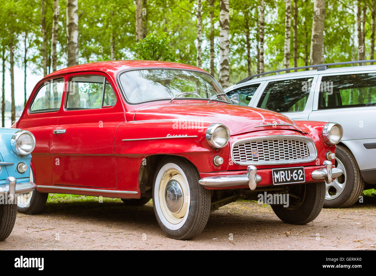 KOTKA, FINLAND - JUNE 14, 2014: Red Skoda Felicia coupe parked on shore of Finnish gulf. Festival and exhibition of retro-club Stock Photo