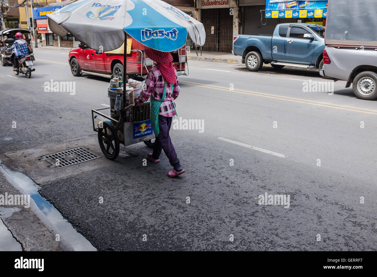Mobile street food trader pushing cart,Chiang Mai,Thailand Stock Photo