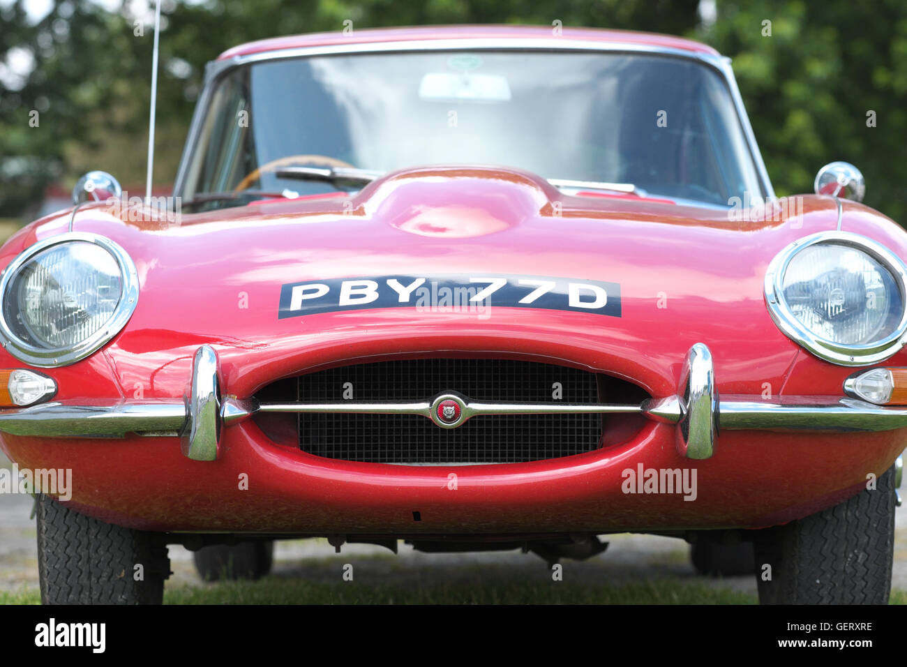 Red Jaguar E Type British sports car made in the mid Sixties 1960s Stock Photo