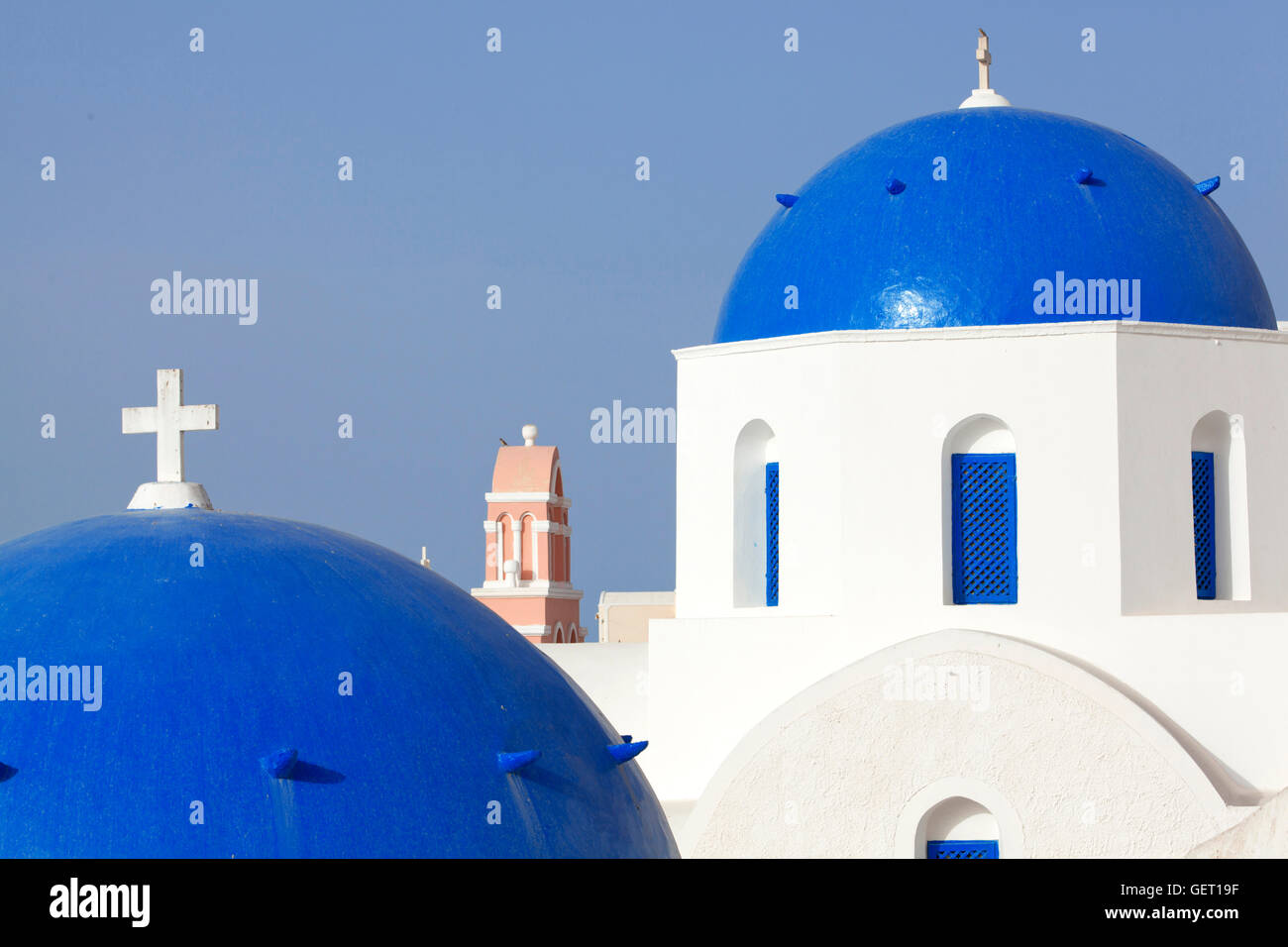 A view of the blue domed roofs of some Greek Orthodox churches in the village of Oia on