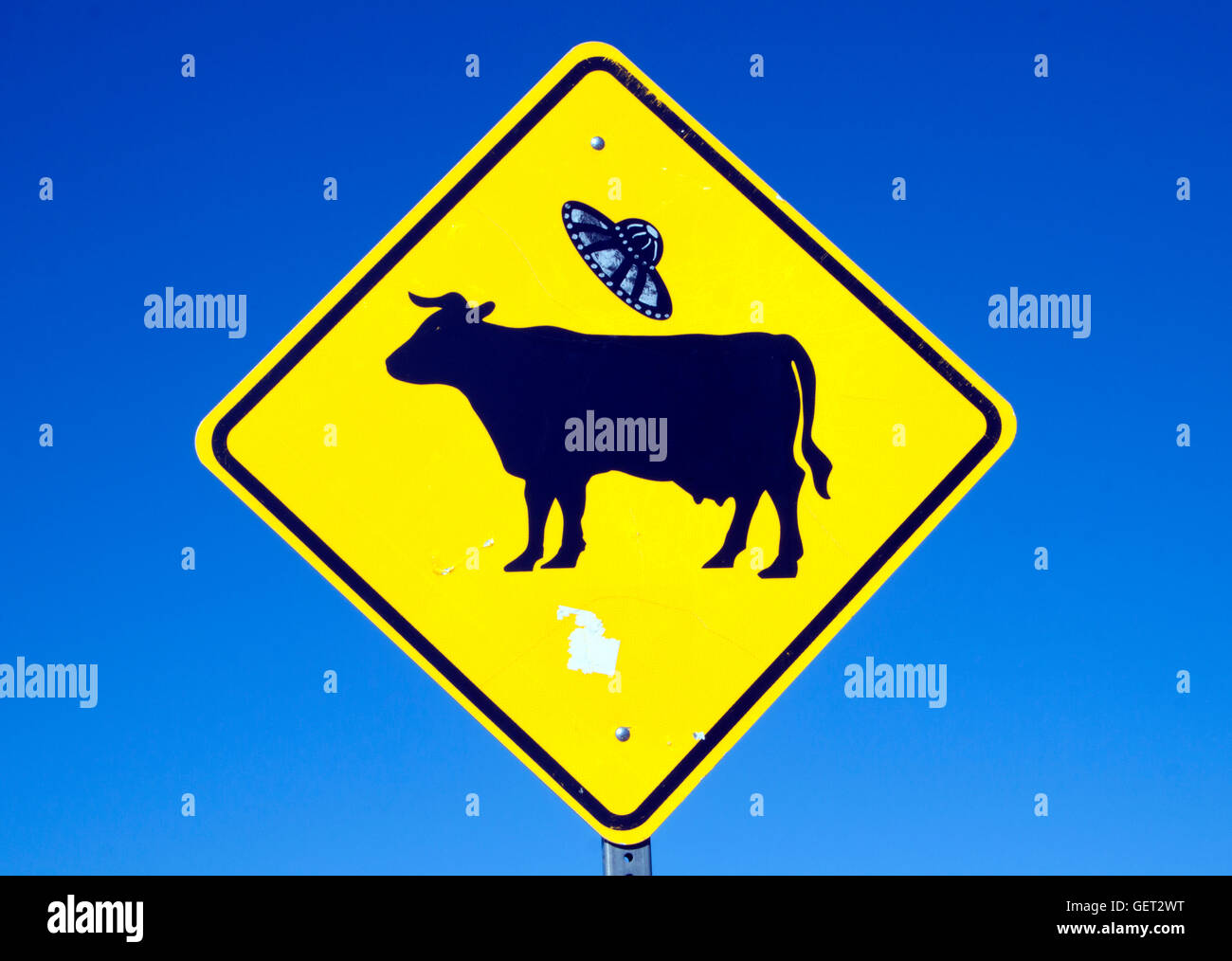 Cow UFO sign in Ohkay Owingeh New Mexico Stock Photo