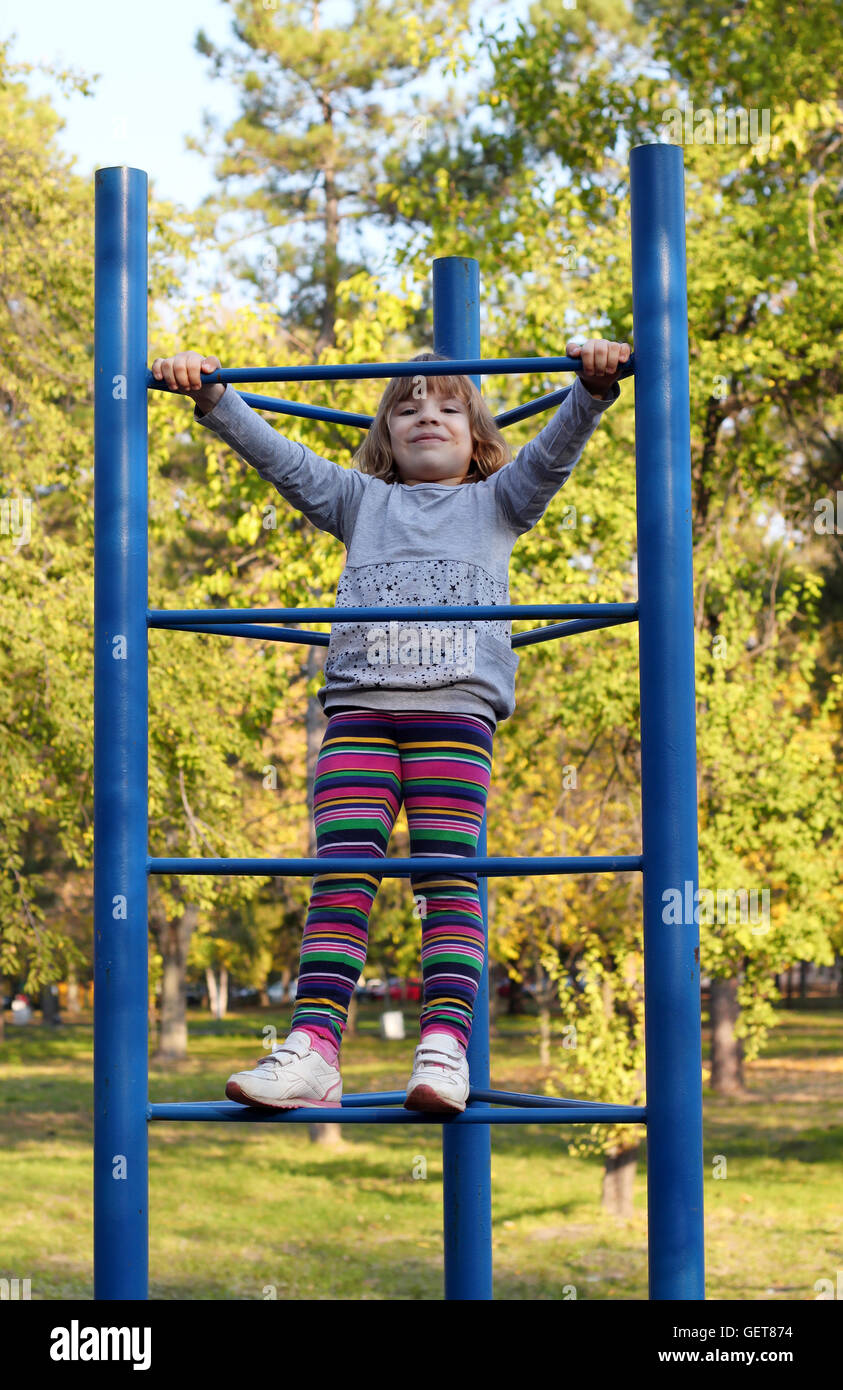 happy little girl on playground Stock Photo - Alamy