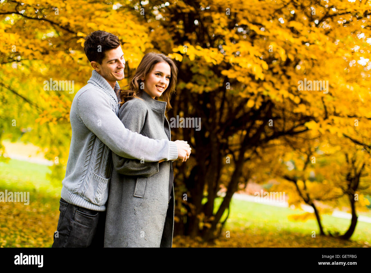 Loving young couple in the autumn park Stock Photo - Alamy