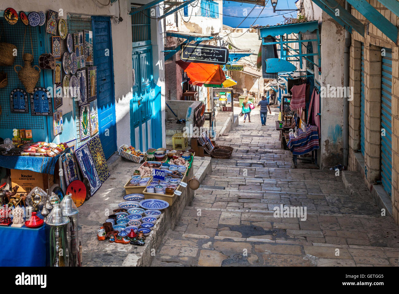 Steep and narrow street in the souk area of the medina in Sousse in Tunisia. Stock Photo