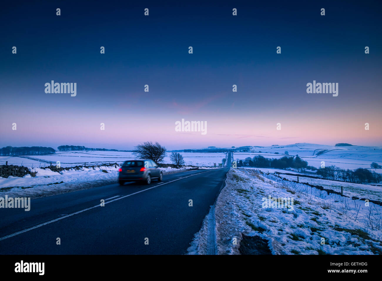 The A515 north of Ashbourne on a winter evening. Stock Photo