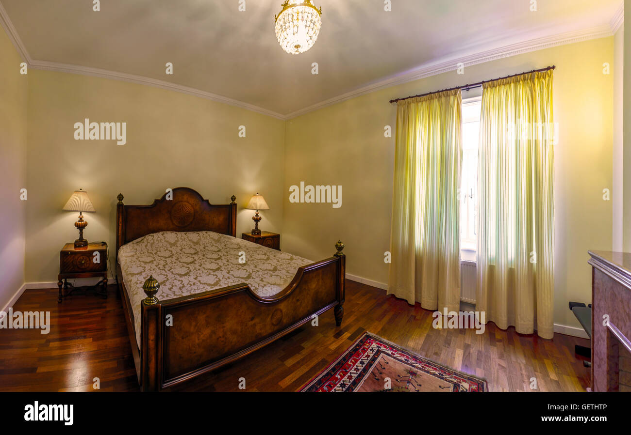Classic style bedroom in luxury hotel, wood and warm light Stock Photo ...