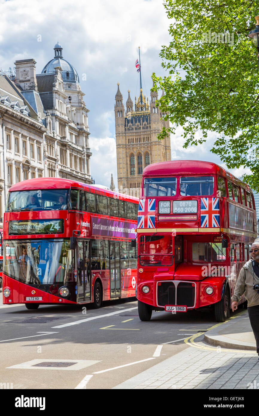 A new Routemaster bus passes an original bus in front of the Houses of ...