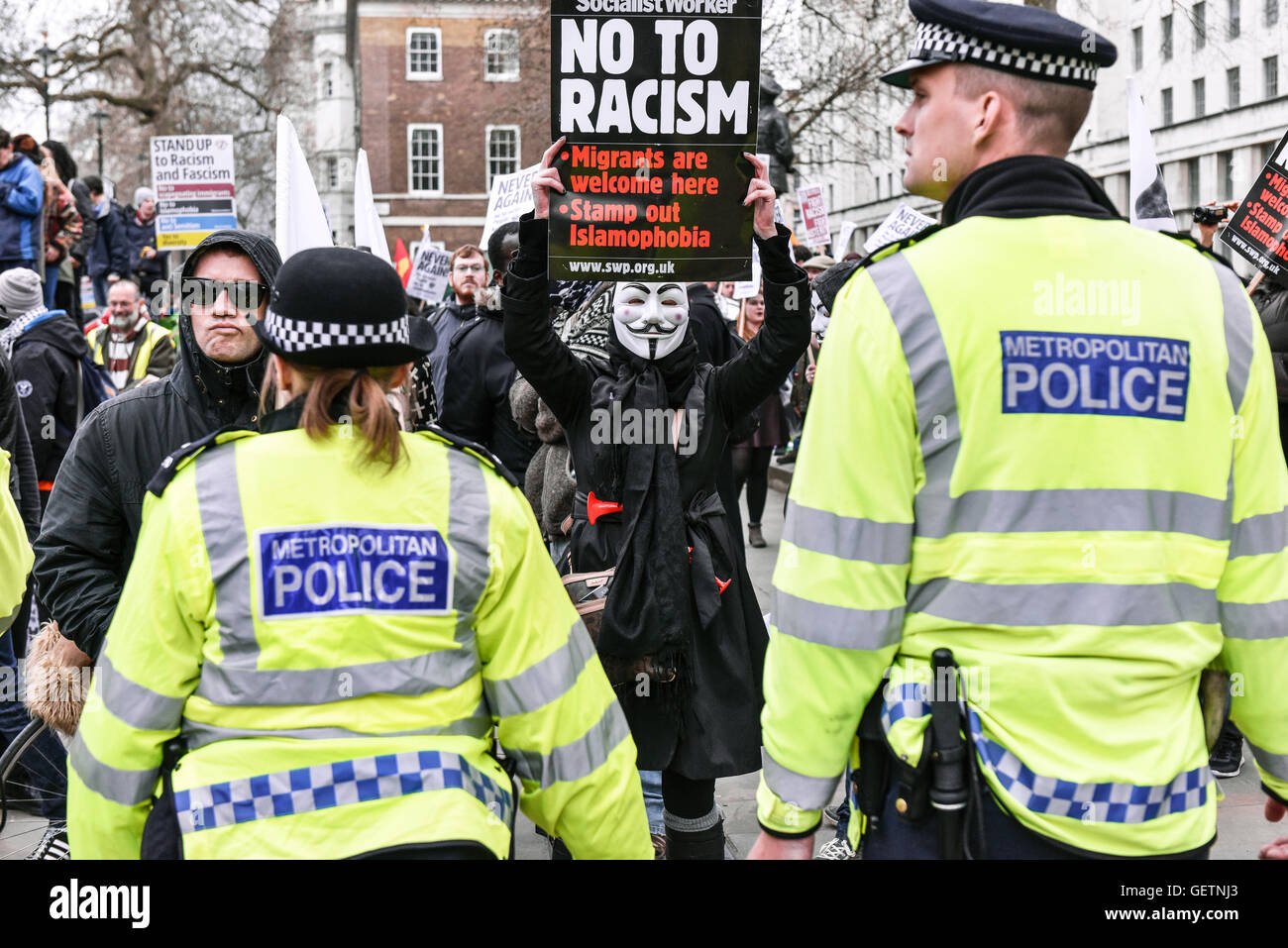 Anti-fascist demonstrators confronting a Metropolitan Police cordon at a demonstration in Whitehall. Stock Photo