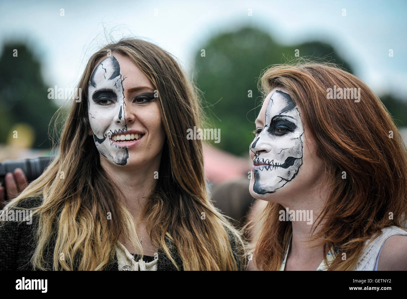 Two festivalgoers with painted faces at the Together The People Festival. Stock Photo