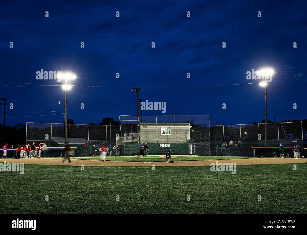 Little League baseball game at night Stock Photo Alamy