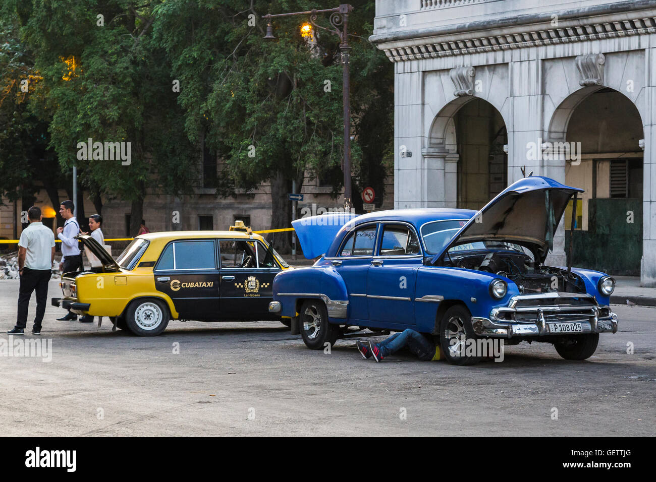 Vintage American car broken down on the street in Havana. Stock Photo