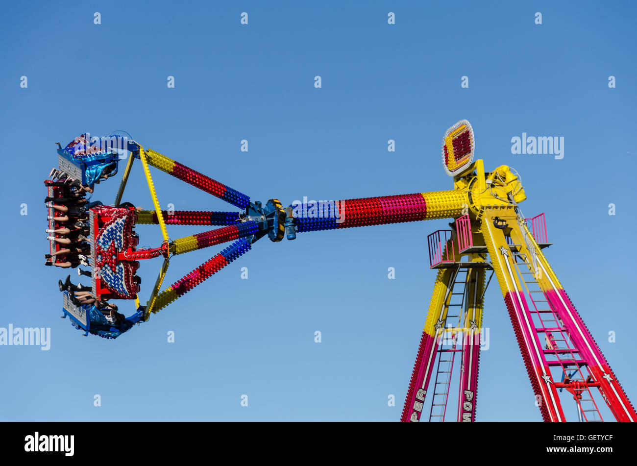People ride a pendulum ride at a funfair Stock Photo Alamy