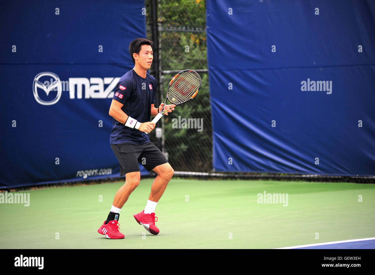 The Japanese tennis player Kei Nishikori practicing at the 2016 Rogers
