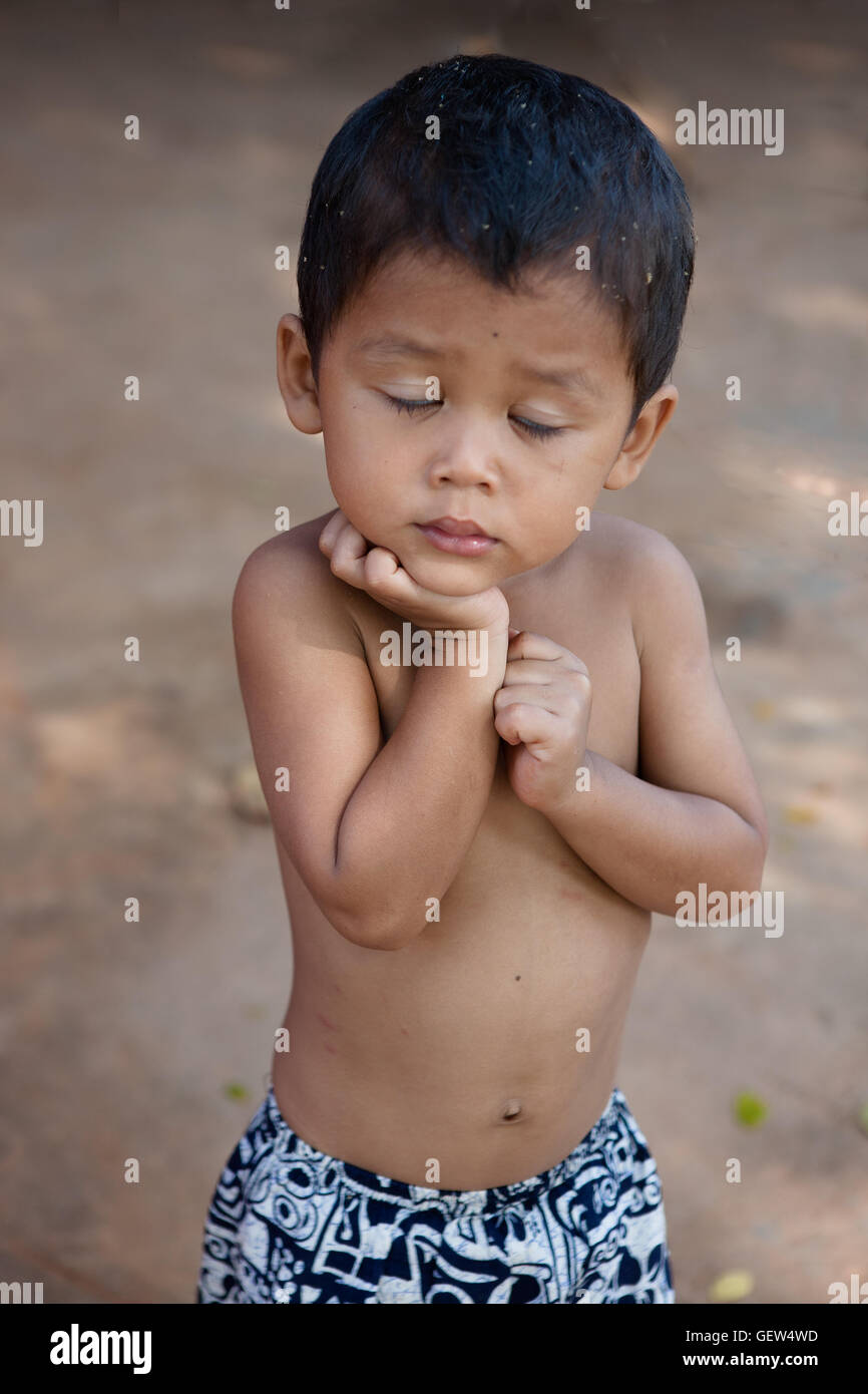 Shy young lad, Ta Chet village, Somroang Yea Commune, Puok District, Siem Reap Province, Cambodia Stock Photo