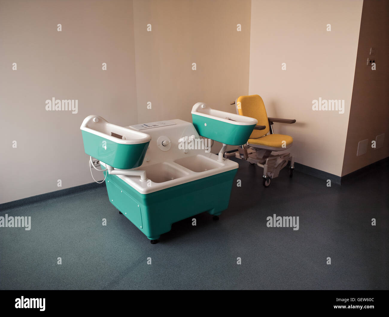 Four cell bath and wheelchair in therapeutic room Stock Photo