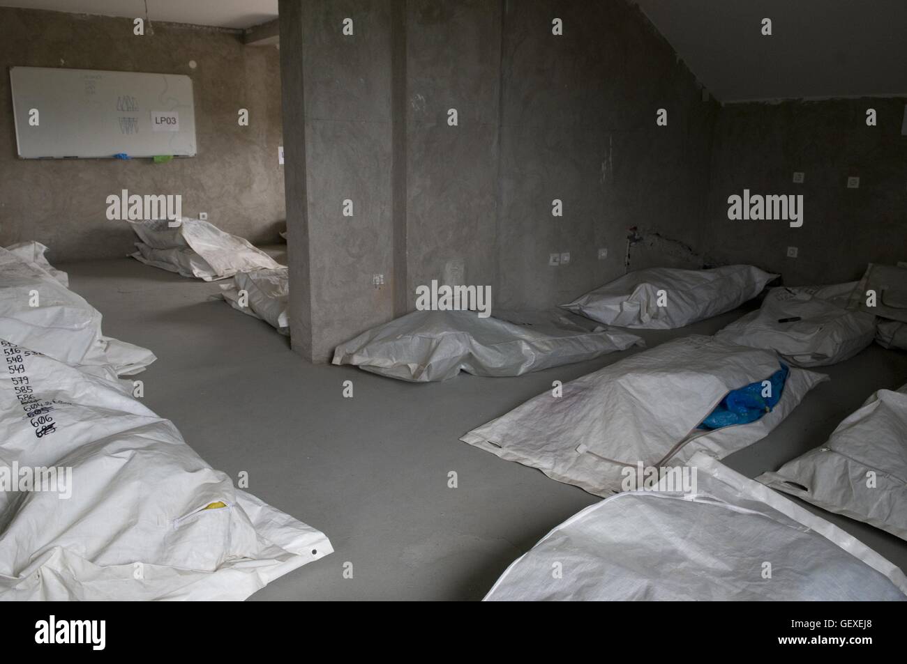 Remains of a victims of the Srebrenica massacre lying inside plastic bags at the mortuary facility of the International Commission on Missing Persons (ICMP) in the industrial town of Tuzla in Bosnia. More than 8,000 Bosnian Muslim men and boys were killed after the Bosnian Serb Army attacked Srebrenica, a designated UN safe area, on 10-11 July 1995, despite the presence of UN peacekeepers. Stock Photo