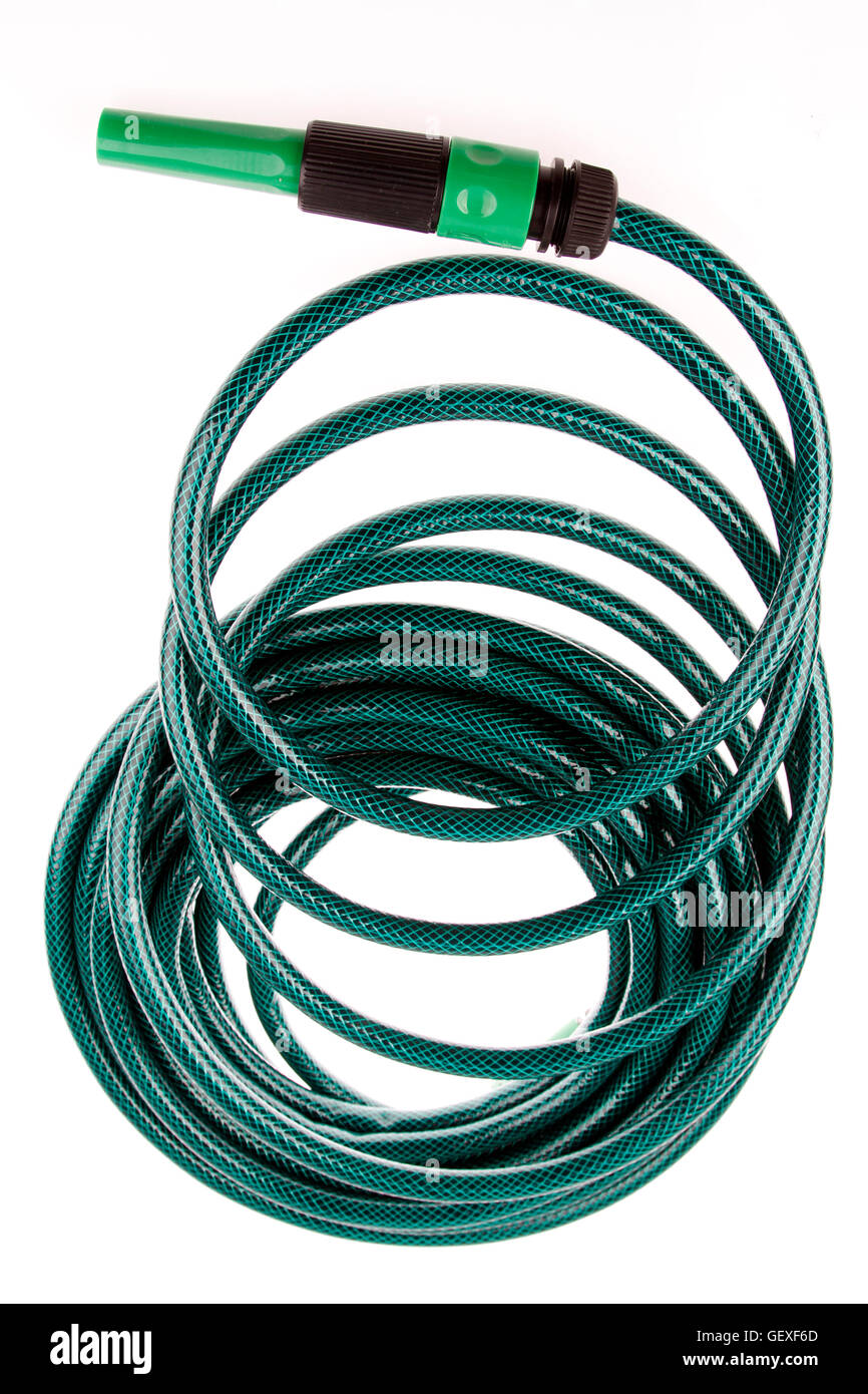 Garden hose coiled on plain background Stock Photo Alamy