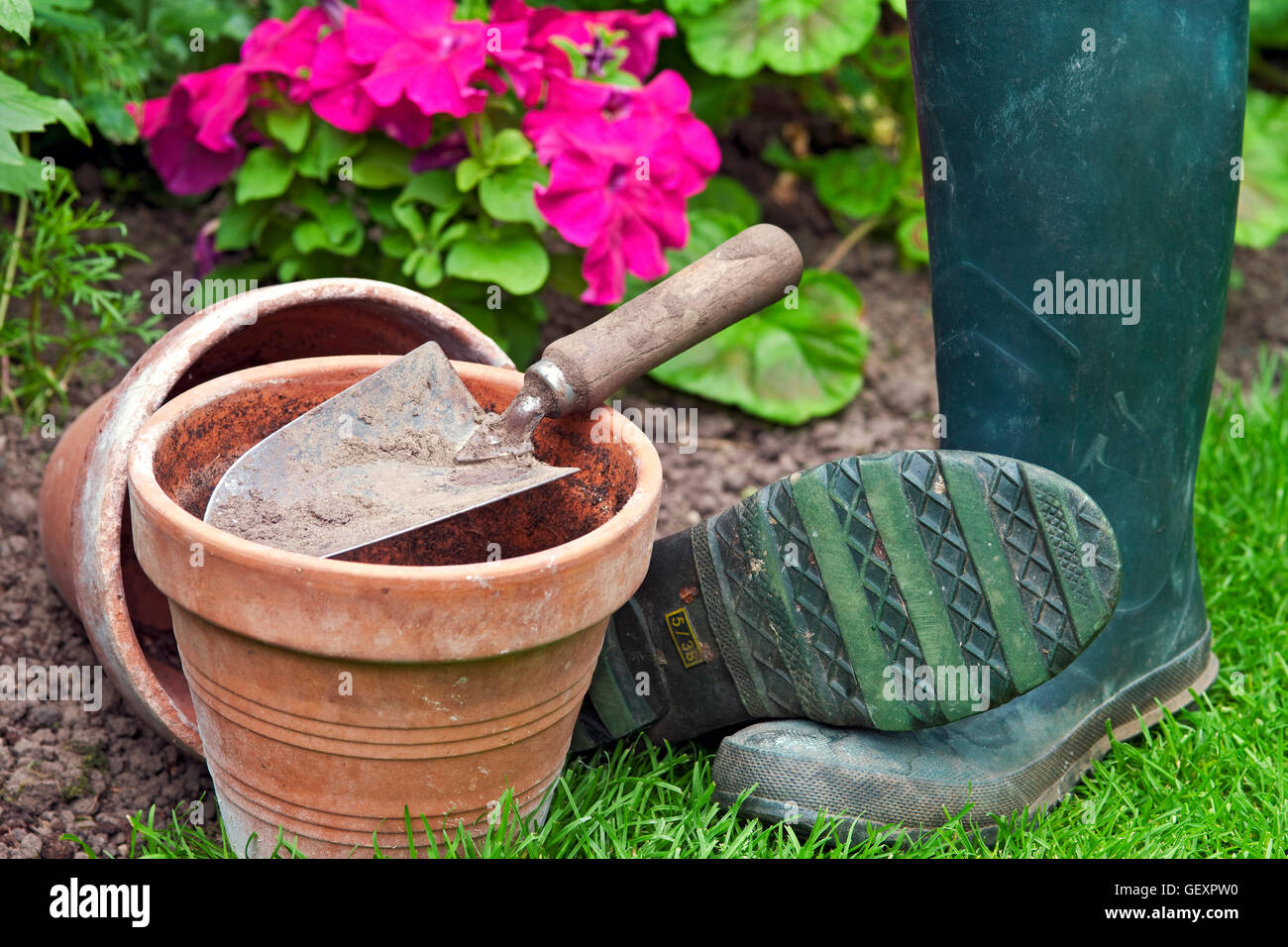 Clay pots and a garden trowel. Stock Photo