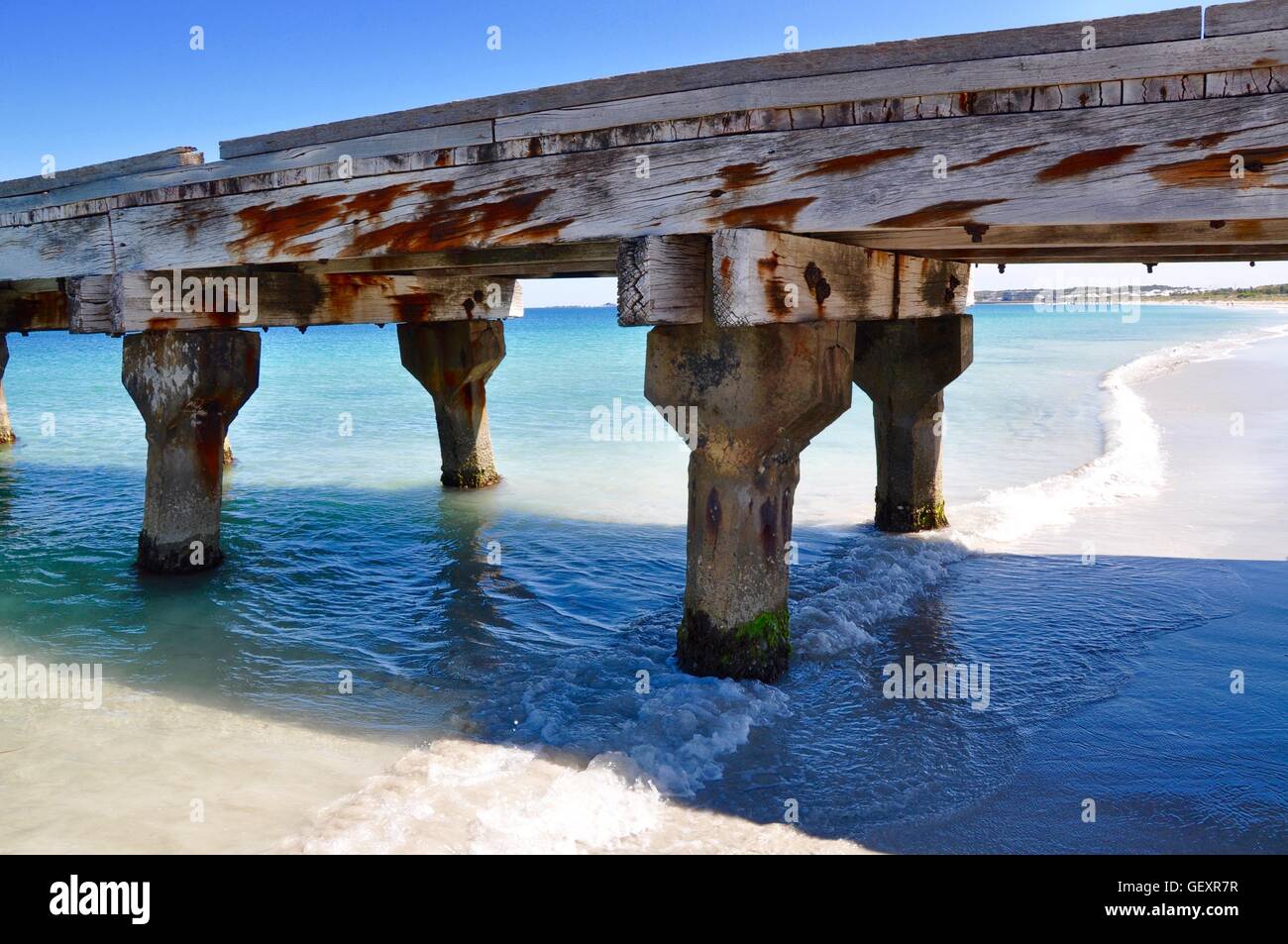 Portion of the Coogee Beach jetty structure with turquoise Indian Ocean waters on the coast of Coogee, Western Australia. Stock Photo