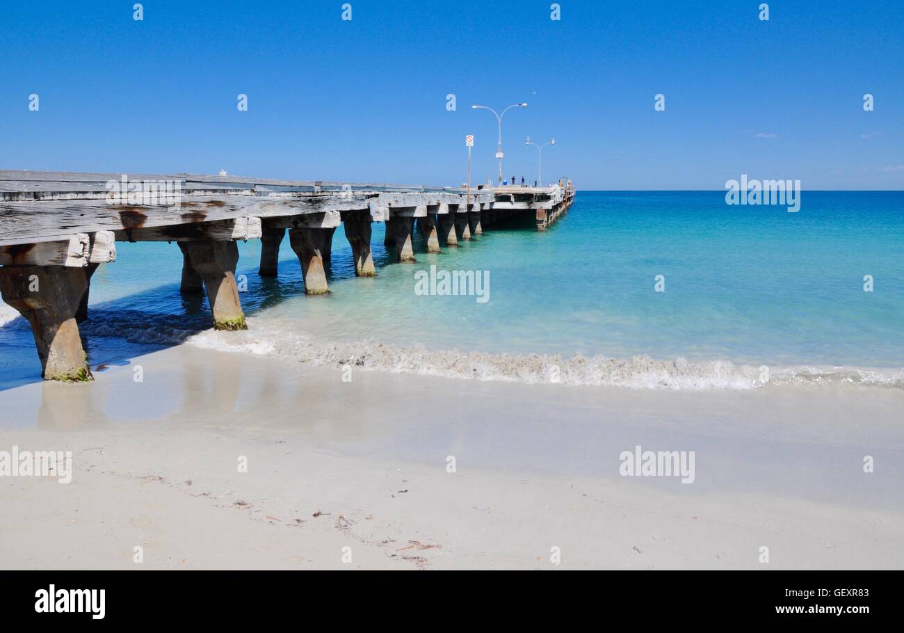 Weathered beach jetty with the Indian Ocean seascape on a clear day in Coogee, Western Australia. Stock Photo