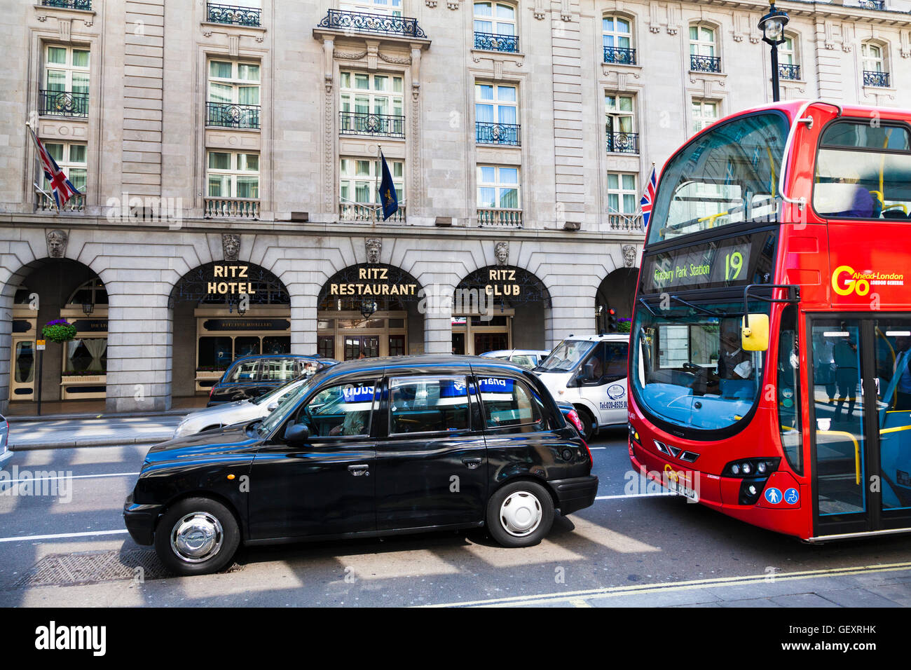 London taxi and red bus outside The Ritz. Stock Photo