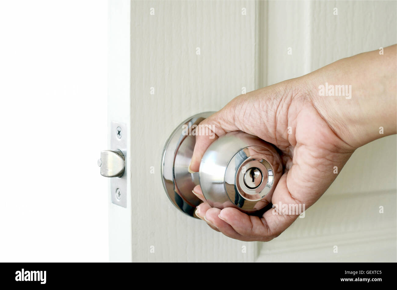 Right hand open the door isolated on white background with clipping path. Stock Photo