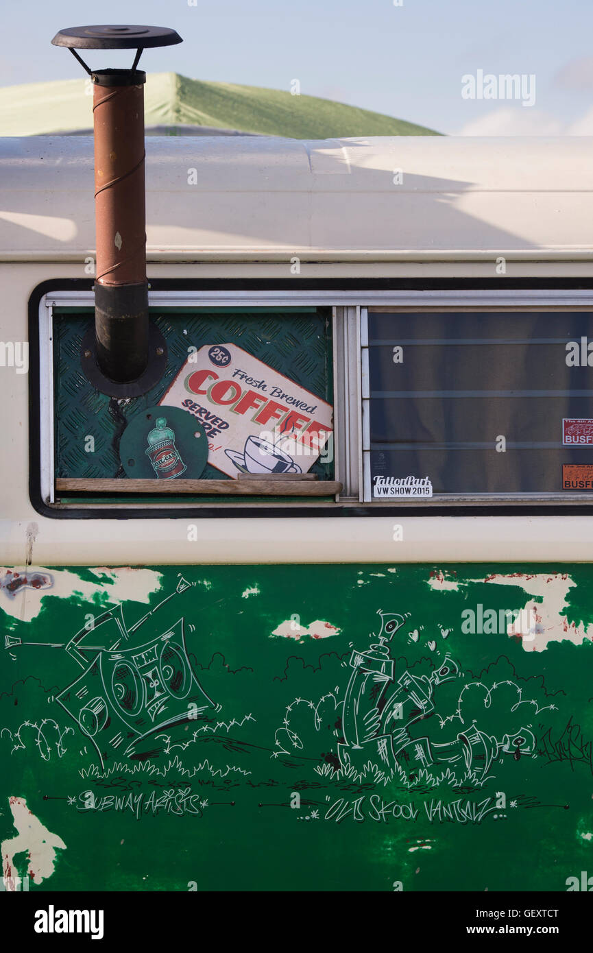 Vintage VW Campervan mobile cafe serving coffee with a chimney at a vw show. Oxfordshire, England Stock Photo