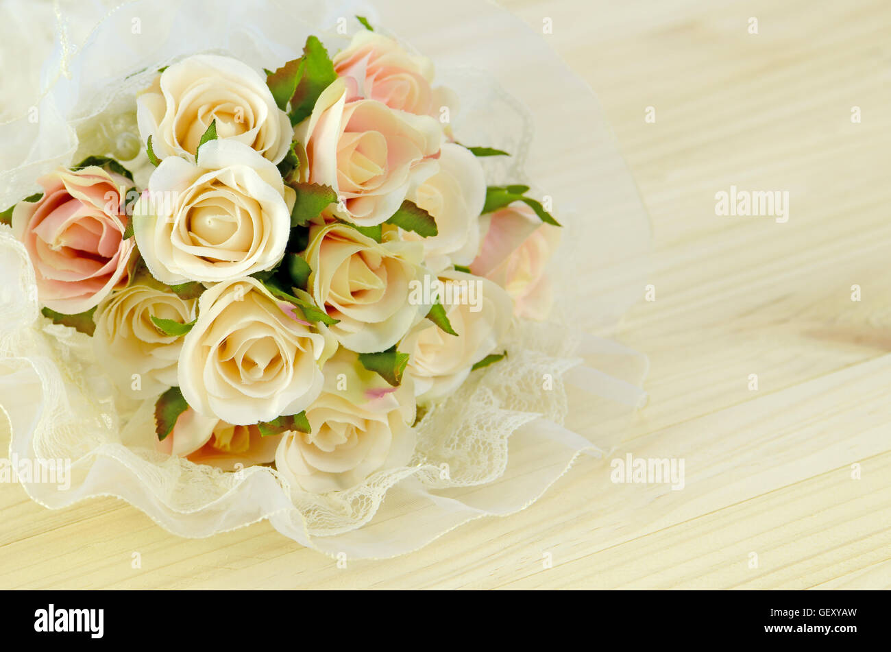 Satin Rose Bouquet on Pine Wood Background. Stock Photo